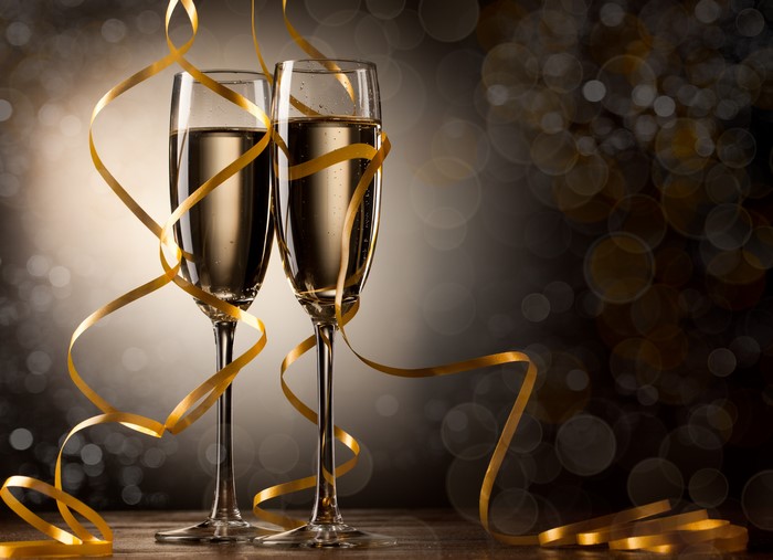 Champagne glasses with gold ribbon