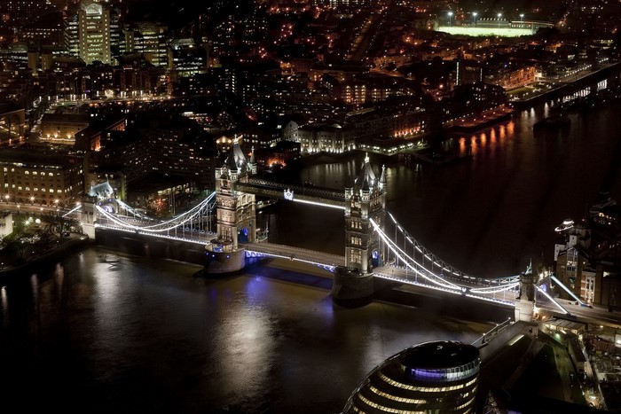 Tower Bridge illuminated at night over the River Thames in London