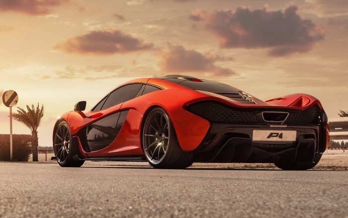 Orange McLaren P1 sports car from behind