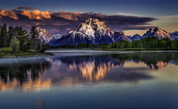 Grand Teton Mountains reflected in a lake, Wyoming, USA