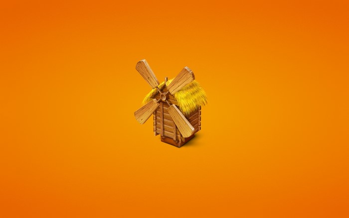 Wooden windmill with thatched roof on orange background