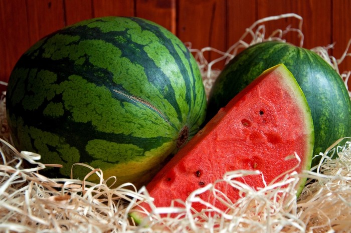 Watermelons and a slice of watermelon