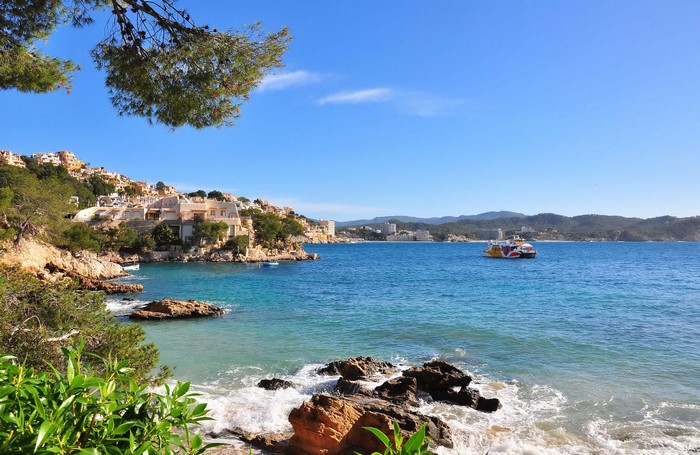 Coastal town with a ferry in the sea, Islas Baleares, Spain