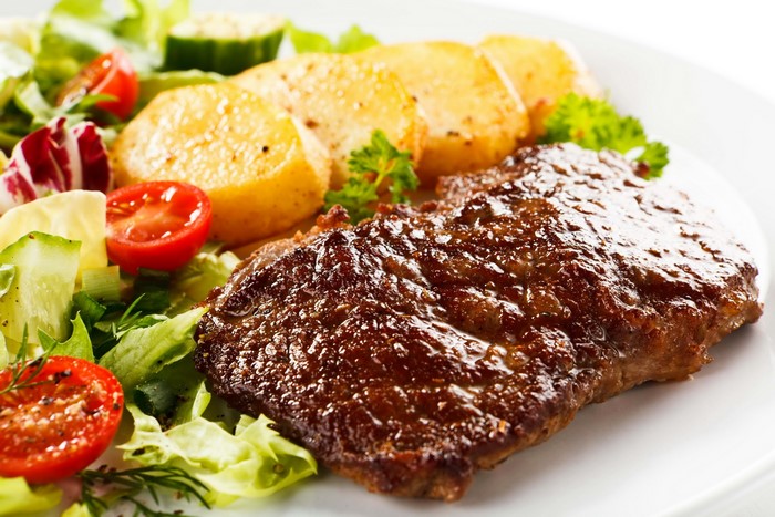 Steak with potatoes and salad