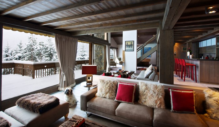 Living room with a view of a snowy forest