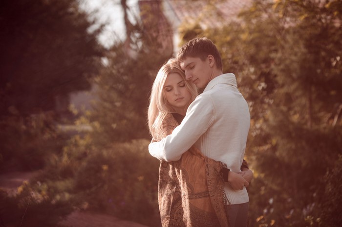 Couple embracing outdoors in autumn