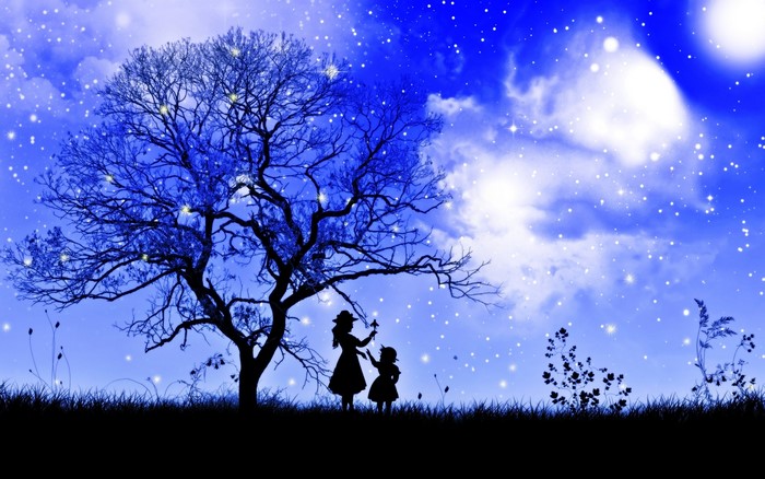 Silhouette of a tree with two people under it at night