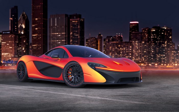 McLaren P1 sports car in front of city skyline