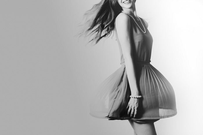 Woman in a dress with pearls