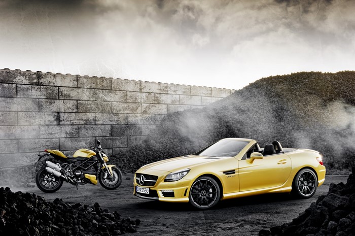 Yellow Mercedes-Benz Cabriolet and Ducati Motorcycle