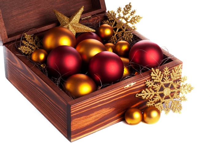 Christmas ornaments in a wooden box with snowflakes