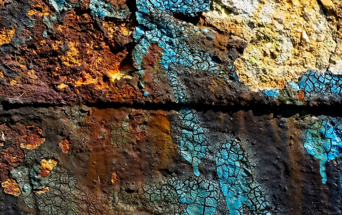 Close-up of a rusty and cracked painted surface
