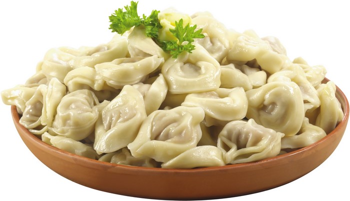 Bowl of boiled dumplings with parsley and butter