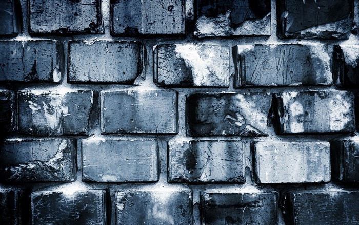 Close-up texture of a weathered brick wall