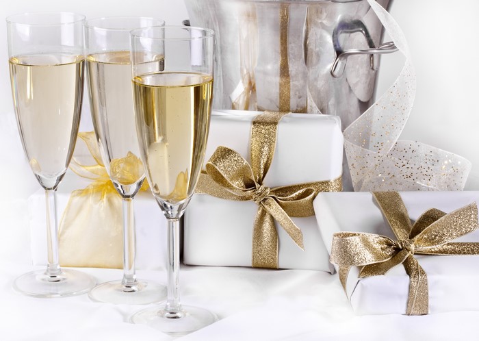 Champagne Glasses and Gifts with Gold Ribbons