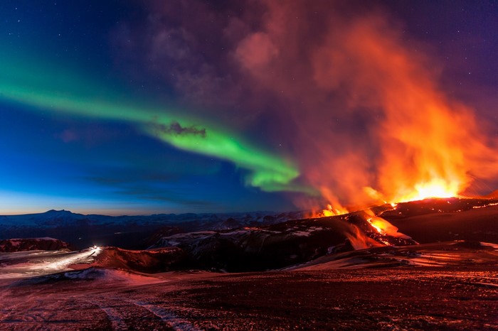 Aurora Borealis over Volcano Eruption