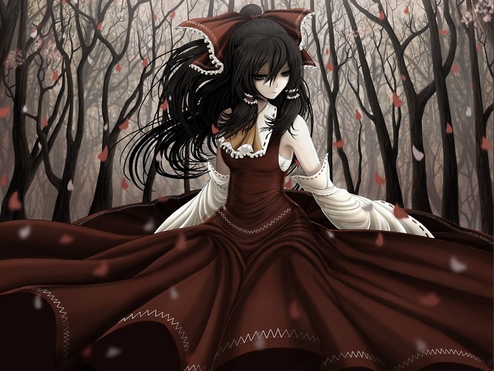 Girl in a red dress in a forest