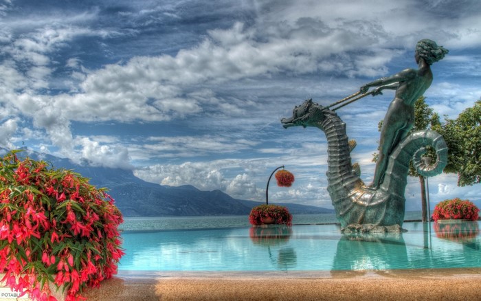 Statue of a woman riding a seahorse in Geneva, Switzerland