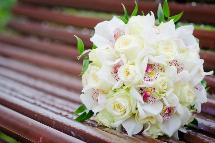White Roses and Orchids Bouquet on a Bench