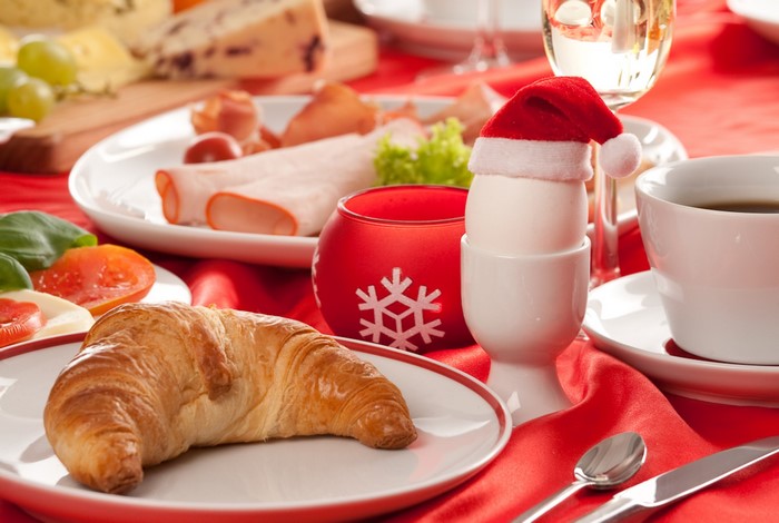 Christmas breakfast with croissant, egg, and coffee