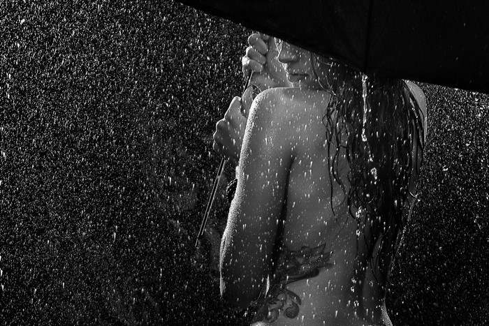 Woman holding umbrella in the rain