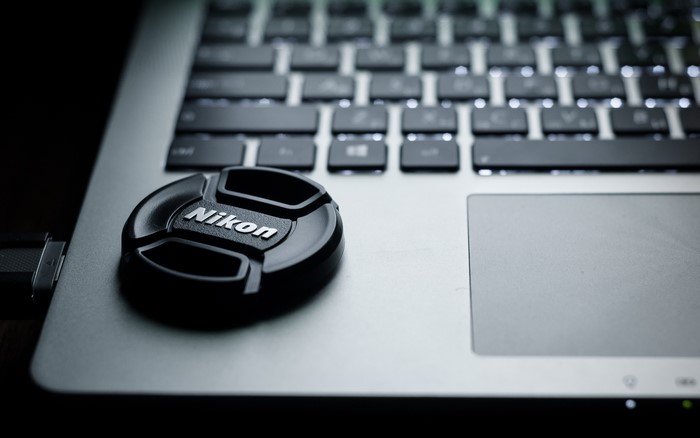 Nikon lens cap on a laptop keyboard