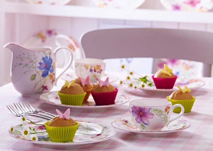 Tea set with cupcakes and a pitcher