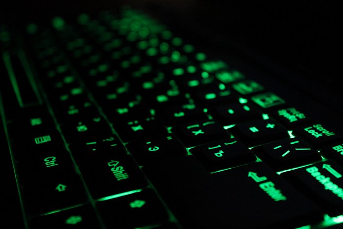 4K Closeup of a Green Backlit Keyboard