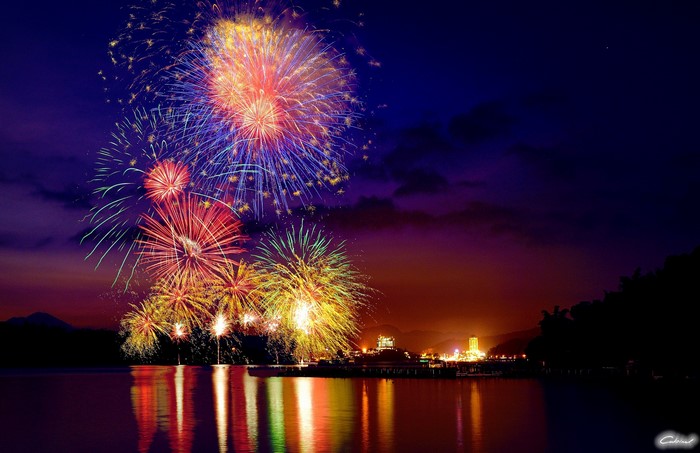 Fireworks over a city skyline at night
