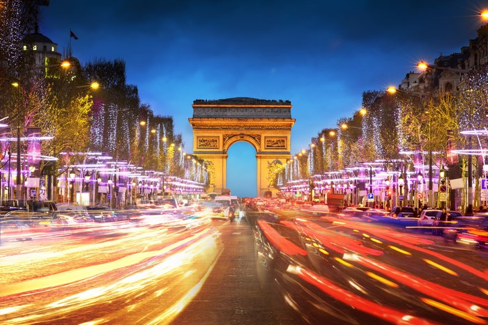 Arc de Triomphe at night with light trails in Paris