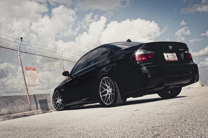 Black BMW 3 Series 335i from back view
