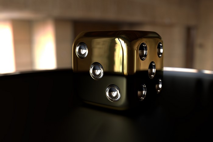 Golden die with visible pips
