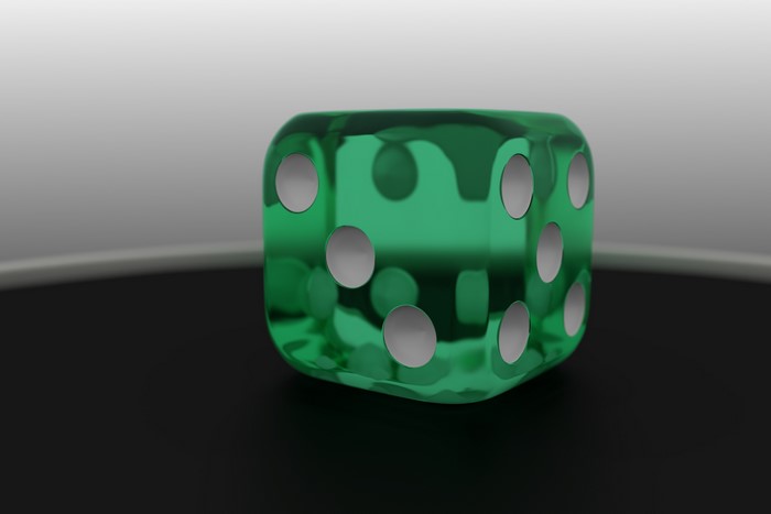 Green translucent die with white pips