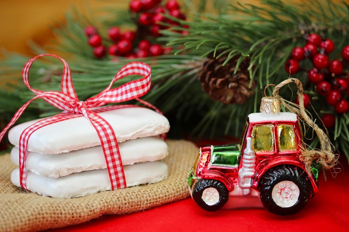 Christmas cookies and tractor ornament with pine branches