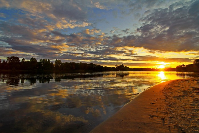 Sunset over a river in Russia with clouds