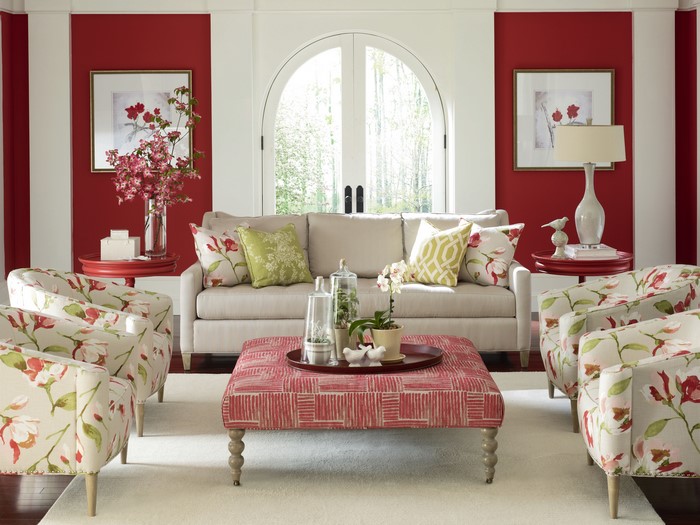 Living room with red walls and floral furniture
