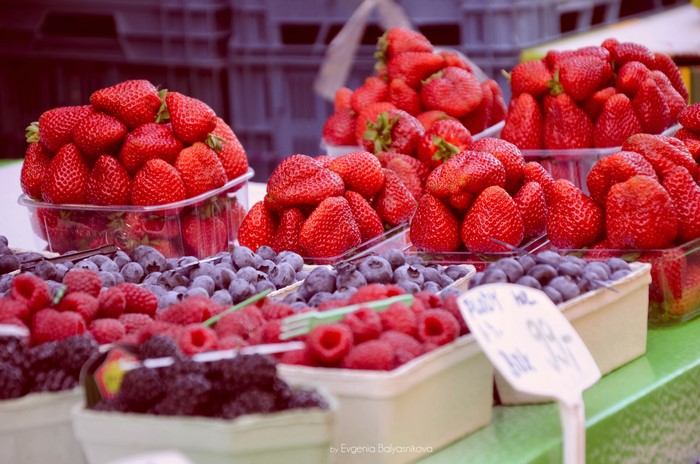 Fresh Strawberries, Raspberries, and Blueberries at a Market