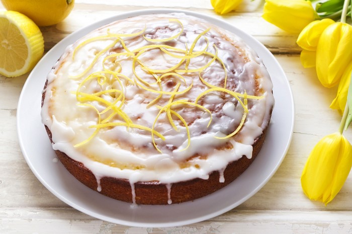 Lemon cake with icing and lemon zest