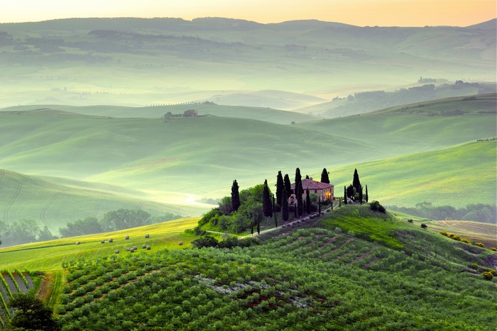 Tuscany landscape with rolling hills and a villa