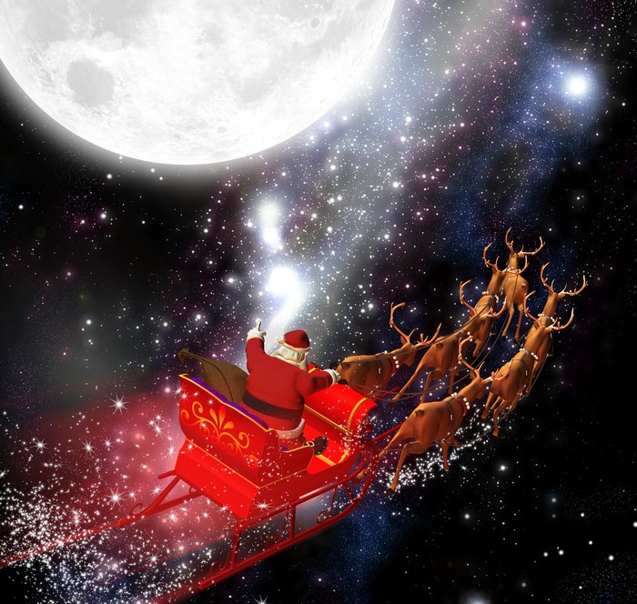 Santa Claus flying in a sleigh with reindeer in space