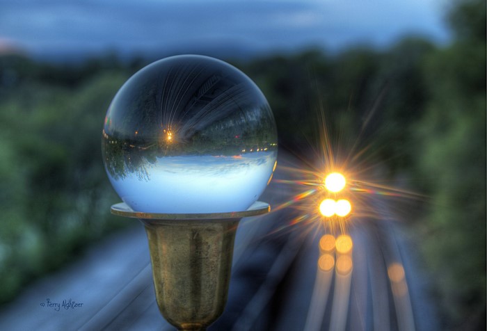 Crystal ball reflecting lights on a pole