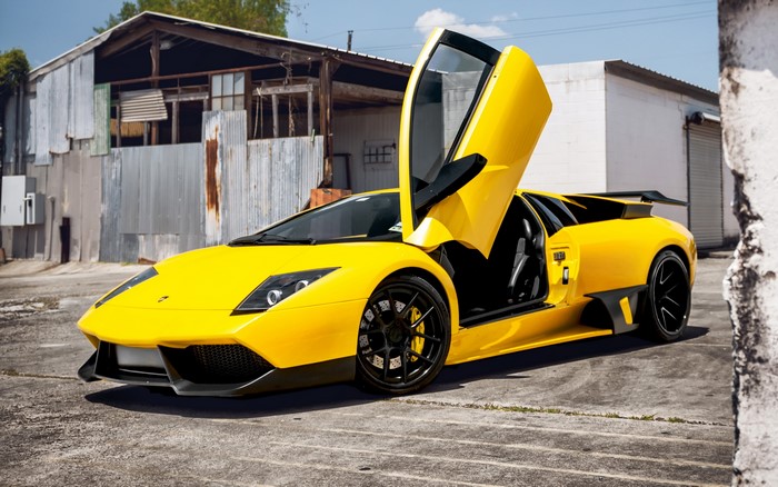 Yellow Lamborghini Murcielago with opened doors