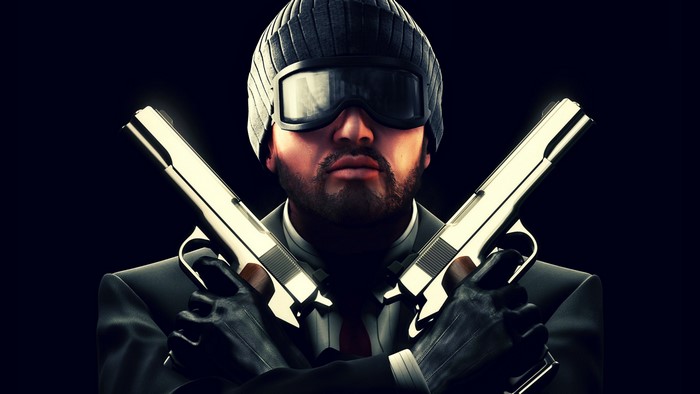 Man in winter hat and glasses holding two pistols