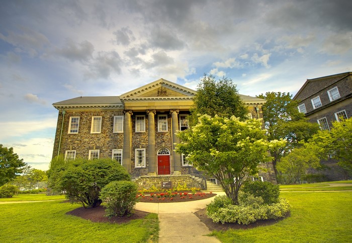 Stone building with columns and red door in Halifax, Nova Scotia