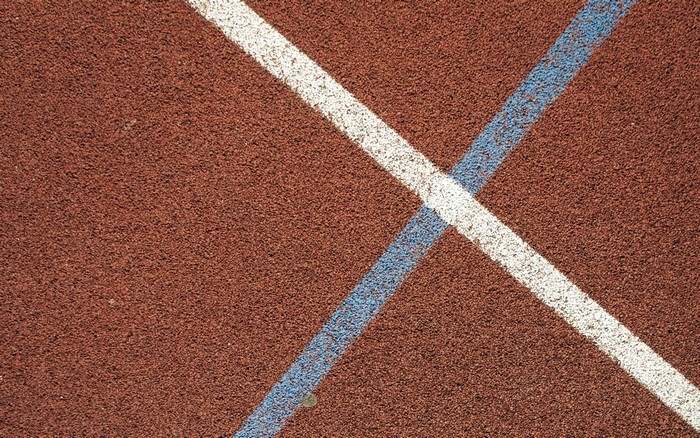 Running track texture with white and blue lines