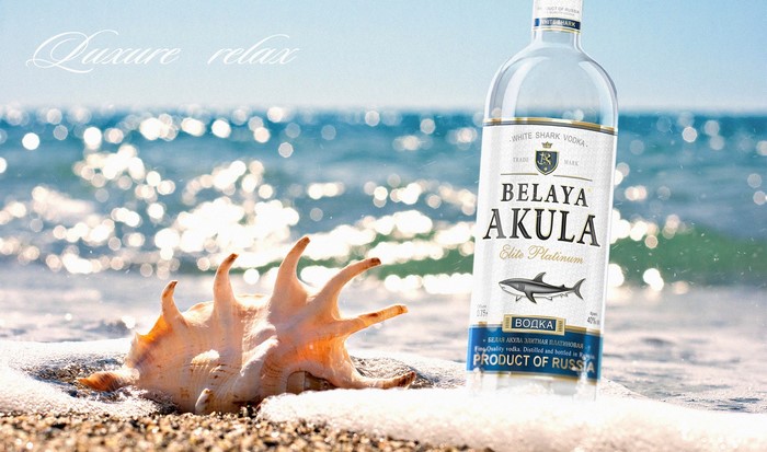 Belaya Akula Vodka bottle on a beach