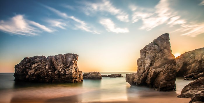 Rocky Coastline at Sunset with Dramatic Clouds