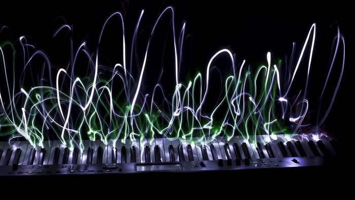 Light painting over a piano keyboard