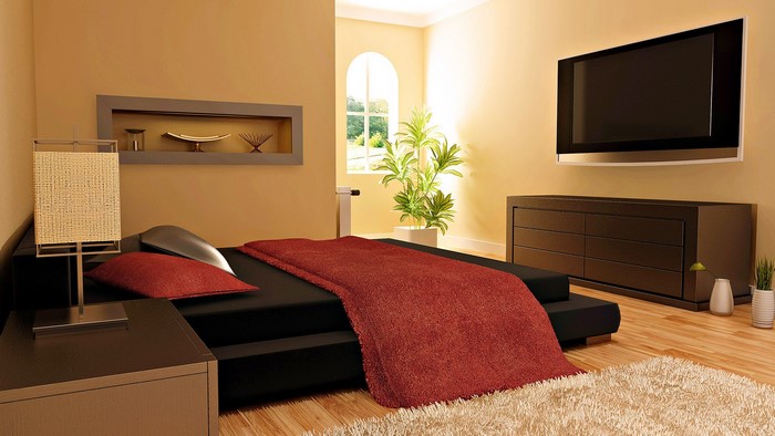 Modern bedroom with bed, dresser, and TV