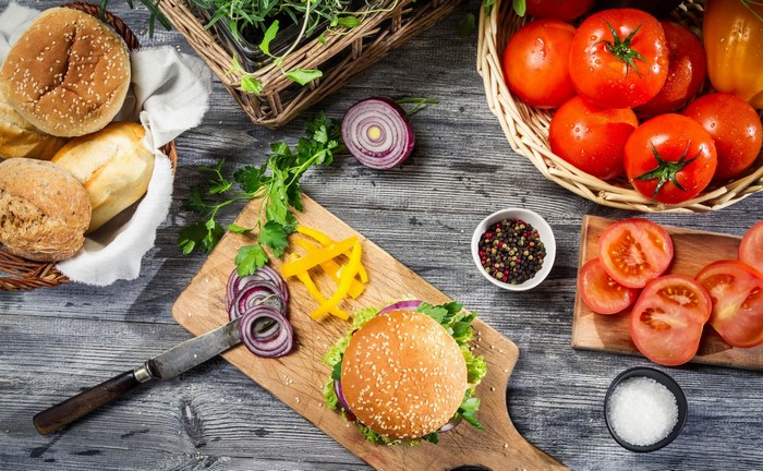 Hamburger ingredients and bread rolls still life